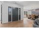Welcoming foyer with hardwood floors, chandelier, and open view to dining area at 935 Tiber Cir, Alpharetta, GA 30022