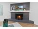 Modern fireplace with black brick, stylish decor, and hardwood flooring at 935 Tiber Cir, Alpharetta, GA 30022