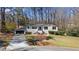 Charming ranch home with black garage, landscaped yard and stone accents at 935 Tiber Cir, Alpharetta, GA 30022