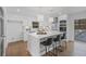 Bright kitchen with a quartz island, modern appliances, and an adjacent dining area at 935 Tiber Cir, Alpharetta, GA 30022