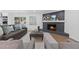 Spacious living area featuring a fireplace, hardwood floors, and an open concept design at 935 Tiber Cir, Alpharetta, GA 30022