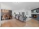 Open concept living room and dining area showcasing hardwood floors, fireplace and modern decor at 935 Tiber Cir, Alpharetta, GA 30022