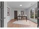 Bright home office with natural light, desk, chair, and decorative artwork at 935 Tiber Cir, Alpharetta, GA 30022
