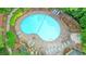 Aerial view of a kidney-shaped community pool surrounded by many lounge chairs at 1507 Country Park Se Dr, Smyrna, GA 30080