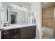 Well-lit bathroom with modern vanity, ample counter space, and tiled shower/tub combo at 1507 Country Park Se Dr, Smyrna, GA 30080