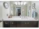 Modern bathroom with long vanity, under-mount sink and large mirror at 1507 Country Park Se Dr, Smyrna, GA 30080