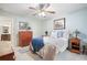 Bright bedroom with cozy bed featuring a blue throw and stylish dressers at 1507 Country Park Se Dr, Smyrna, GA 30080