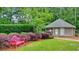 Community grounds with colorful landscaping and a bench next to the restrooms at 1507 Country Park Se Dr, Smyrna, GA 30080