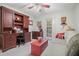 Comfortable living room with stylish desk, a bright red coffee table, and lots of storage at 1507 Country Park Se Dr, Smyrna, GA 30080