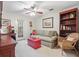 Cozy living room features comfortable seating, a charming bookcase, and a bright red coffee table at 1507 Country Park Se Dr, Smyrna, GA 30080