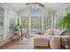 Bright and airy sun room filled with natural light, plants, and comfortable seating at 1507 Country Park Se Dr, Smyrna, GA 30080