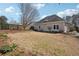 A home's expansive backyard featuring mature trees, lush greenery, and a well-manicured lawn at 4010 Arborwood Ln, Tucker, GA 30084