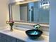 Modern bathroom vanity with decorative mirror and glass bowl sink at 4010 Arborwood Ln, Tucker, GA 30084