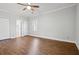 Bedroom with hardwood floors, ceiling fan, and closet at 4010 Arborwood Ln, Tucker, GA 30084