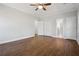 Bedroom with hardwood floors, ceiling fan, and double door closets at 4010 Arborwood Ln, Tucker, GA 30084