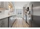 Modern kitchen with stainless steel appliances, light gray cabinets and subway tile backsplash at 4010 Arborwood Ln, Tucker, GA 30084