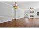 Living room with a fireplace, hardwood floors and a chandelier at 4010 Arborwood Ln, Tucker, GA 30084