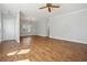 Spacious living area features beautiful hardwood floors and a decorative ceiling fan at 4010 Arborwood Ln, Tucker, GA 30084