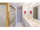 Bright bathroom with double sinks, a shower, and tiled floors, designed for functionality at 50 Sycamore Sta, Decatur, GA 30030