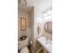 Half-bathroom with pedestal sink, round mirror, and toilet at 50 Sycamore Sta, Decatur, GA 30030