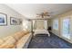 This bedroom features a neutral color palette, large windows, plush carpeting, and a convenient Murphy bed at 50 Sycamore Sta, Decatur, GA 30030