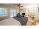 Comfortable bedroom with a door to the backyard, a ceiling fan, and relaxed seating at 50 Sycamore Sta, Decatur, GA 30030