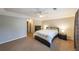 Neutral bedroom featuring carpet, a ceiling fan, and dark wood furniture at 50 Sycamore Sta, Decatur, GA 30030