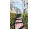 Stairs leading to home entrance with black railings and decorative tile steps, surrounded by shrubs at 50 Sycamore Sta, Decatur, GA 30030