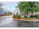 Charming townhome featuring a two-car garage, second story balcony, and professionally landscaped yard at 50 Sycamore Sta, Decatur, GA 30030