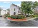 Charming townhome featuring a two-car garage, second story balcony, and professionally landscaped yard at 50 Sycamore Sta, Decatur, GA 30030