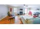 Cozy living room featuring hardwood floors, fireplace, a ceiling fan, and abundant natural light at 50 Sycamore Sta, Decatur, GA 30030