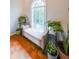 Sitting nook with window and bench surrounded by plants at 50 Sycamore Sta, Decatur, GA 30030