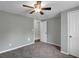 Comfortable bedroom featuring gray walls, cozy carpet, and a ceiling fan for a relaxed ambiance at 5125 West St, Forest Park, GA 30297