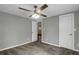 Serene bedroom with soft gray walls, plush carpeting, and a ceiling fan for added comfort at 5125 West St, Forest Park, GA 30297