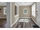 Cozy entryway with wood-look floors, natural light, and updated white trim, creating a cheerful space at 5125 West St, Forest Park, GA 30297