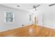 Clean bedroom with hardwood floors, lots of natural light, and white walls at 712 Berts Nw Cir, Lilburn, GA 30047