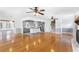 Open-concept living room and kitchen with hardwood floors and updated fixtures at 712 Berts Nw Cir, Lilburn, GA 30047