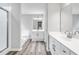 A pristine bathroom shows dual vanities, modern fixtures, wood-look flooring, a tub, and a shower at 980 Charter Club Dr, Lawrenceville, GA 30043