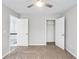 Neutral bedroom with carpeting features a ceiling fan and closet at 980 Charter Club Dr, Lawrenceville, GA 30043