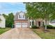 Charming two-story brick home with a two-car garage and well-manicured landscaping at 980 Charter Club Dr, Lawrenceville, GA 30043