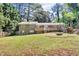 Expansive backyard with large deck, fire pit, and fenced perimeter at 1464 Sagamore Ne Dr, Atlanta, GA 30345