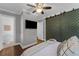 Modern bedroom features an elegant sliding door, ceiling fan, and private bath at 1464 Sagamore Ne Dr, Atlanta, GA 30345