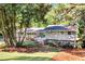 Charming single-Gathering home featuring mature trees, a manicured lawn, and inviting curb appeal at 1464 Sagamore Ne Dr, Atlanta, GA 30345