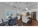 Eat-in kitchen with stainless steel appliances, hardwood floors, and white cabinets at 1464 Sagamore Ne Dr, Atlanta, GA 30345