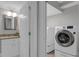 Convenient laundry area with modern washer and dryer near a beautifully appointed bathroom at 1464 Sagamore Ne Dr, Atlanta, GA 30345