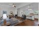 Open concept living room and kitchen with hardwood floors, white wood trim, and modern decor at 1464 Sagamore Ne Dr, Atlanta, GA 30345