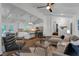 Open concept living room and kitchen with hardwood floors and white wood trim at 1464 Sagamore Ne Dr, Atlanta, GA 30345