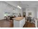 Open concept living room and kitchen with white cabinets, hardwood floors, and stainless appliances at 1464 Sagamore Ne Dr, Atlanta, GA 30345