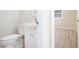 Bathroom featuring a white vanity and toilet, with a glimpse into another room at 4585 Yates Rd, Atlanta, GA 30337