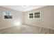 Bright bedroom featuring two windows offering ample natural light and modern vinyl flooring at 4585 Yates Rd, Atlanta, GA 30337